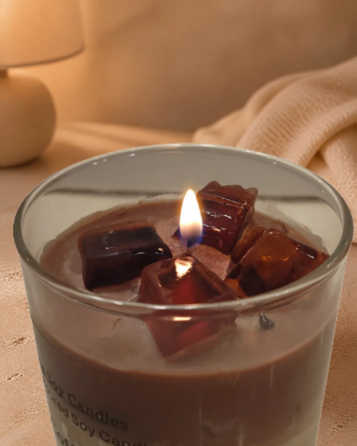 Burning Iced Coffee Latte candle with glowing wax ice cubes