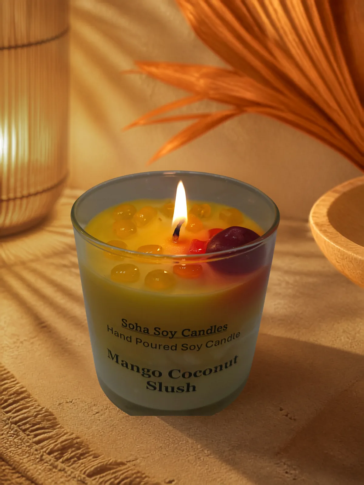Burning Mango Coconut Slush soy candle with warm tropical styling