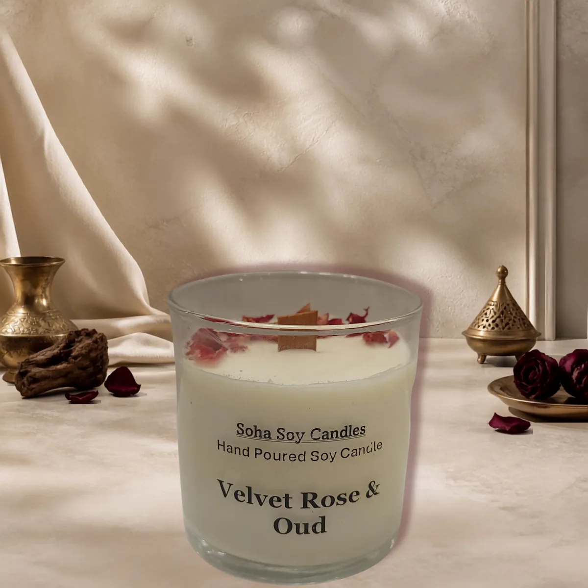Velvet Rose and Oud candle styled in soft neutral decor