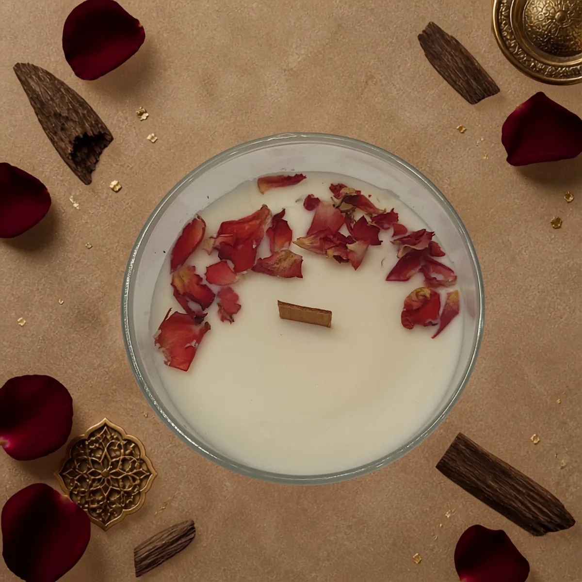 Top view of Velvet Rose and Oud candle with dried rose petals and wood wick